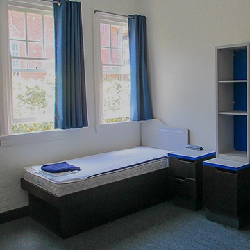 alt="custom modular cabinet installed in hotel dormitory condo"