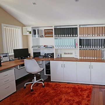 alt="white custom modular cabinet shelves in the home office"